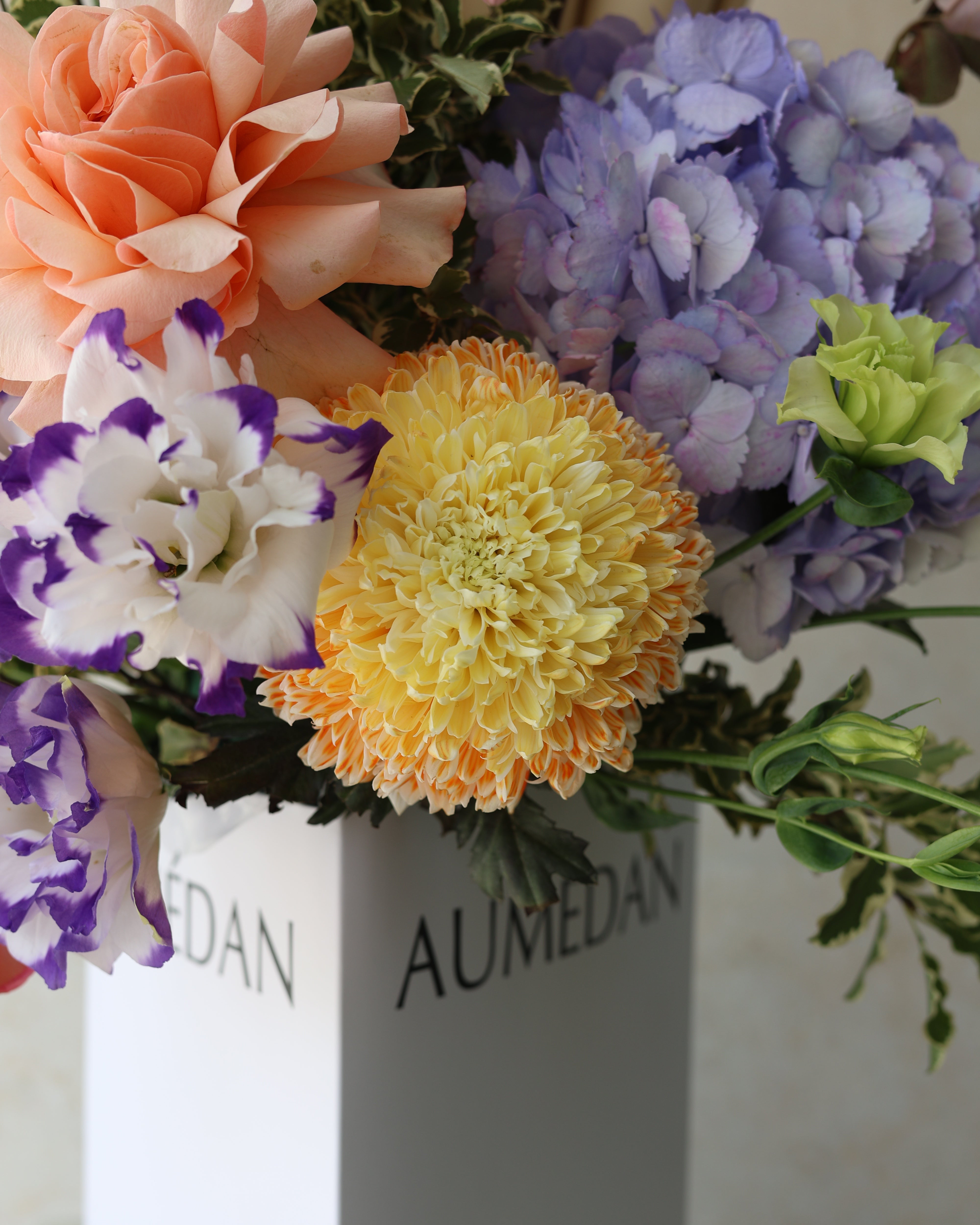BUTTER CREAM BLOSSOMS - TRITOTE BAG ARRANGEMENT