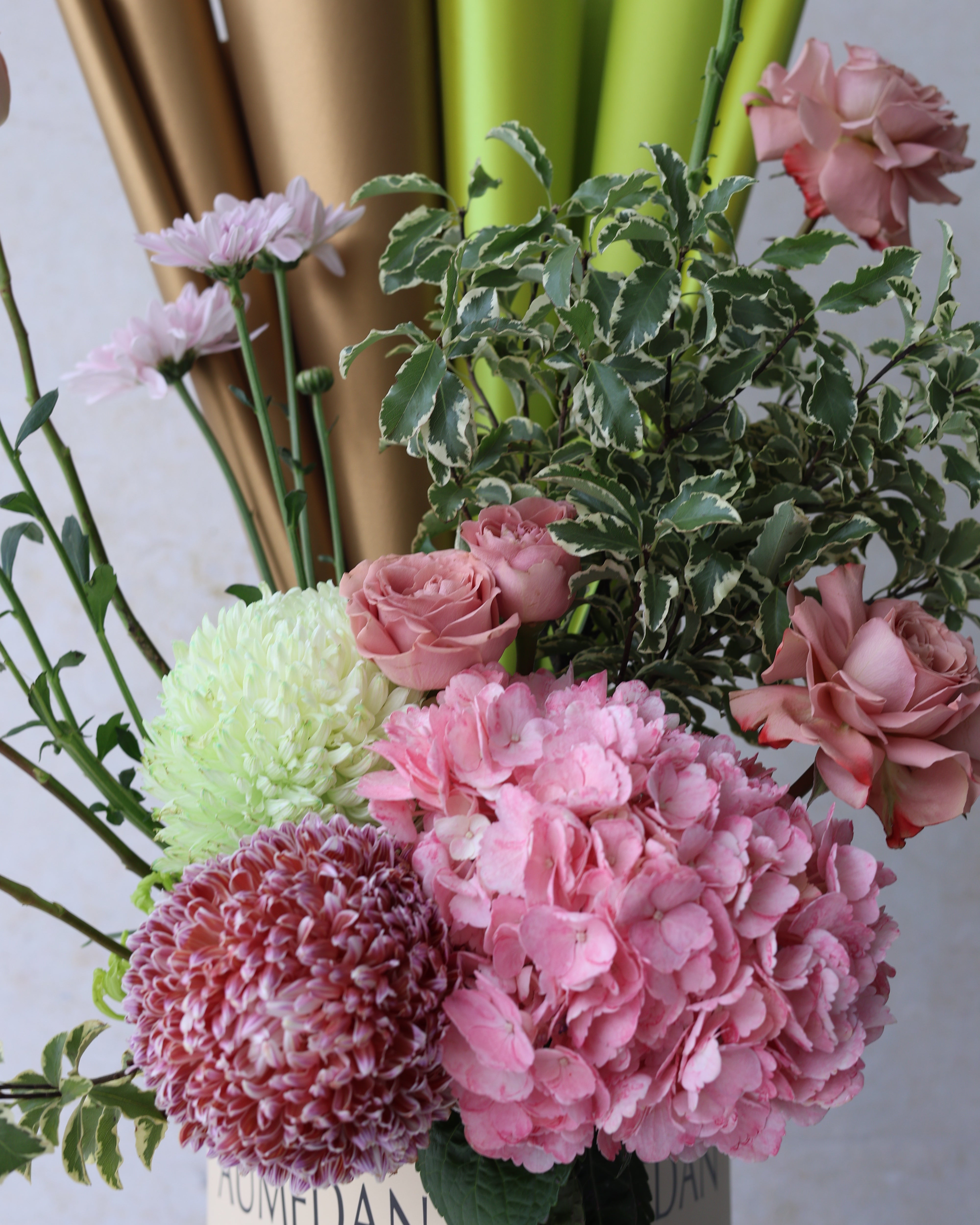 VERDANT GLOW - TRITOTE BAG ARRANGEMENT