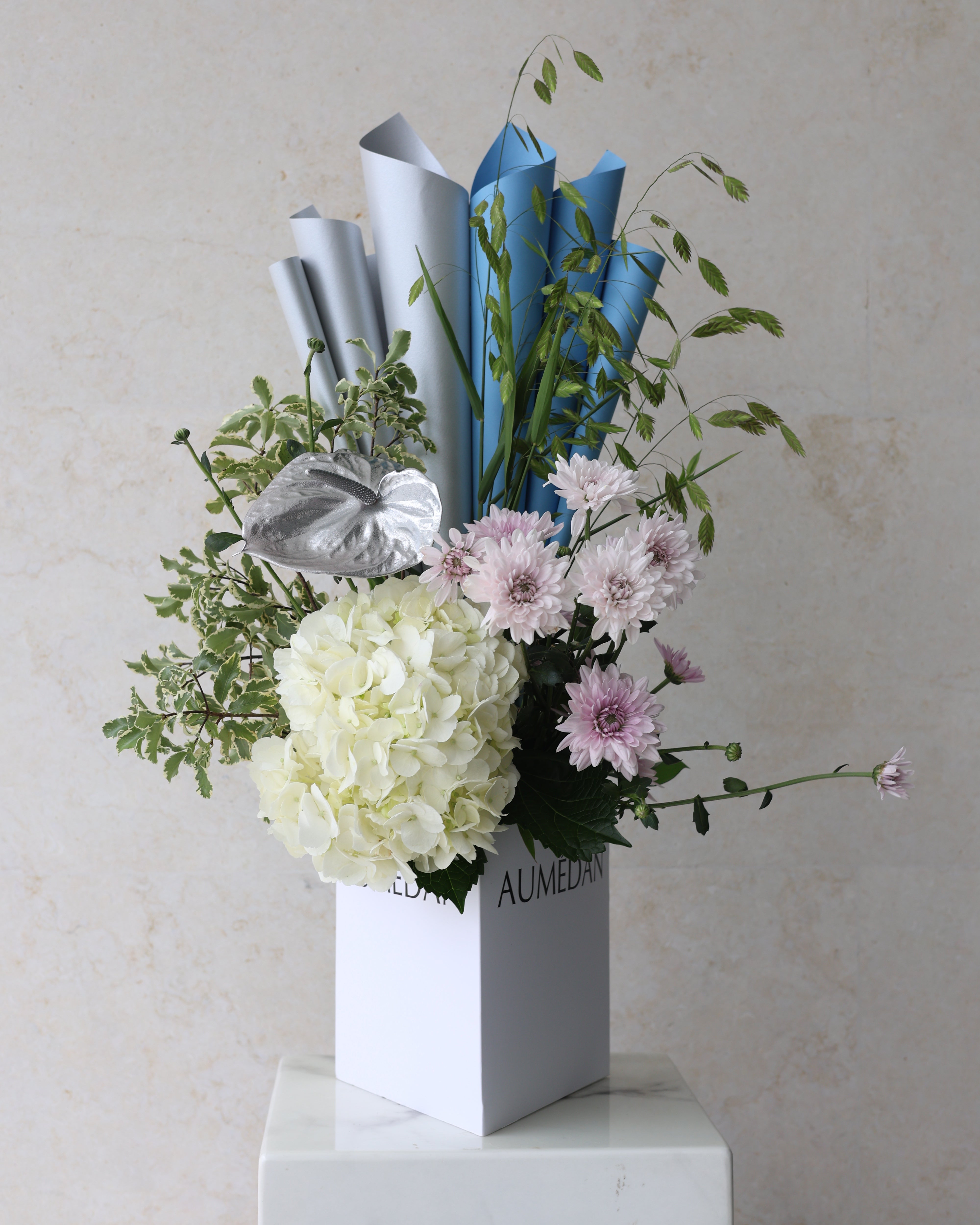 CLESTIAL GLOW - TRITOTE BAG ARRANGEMENT