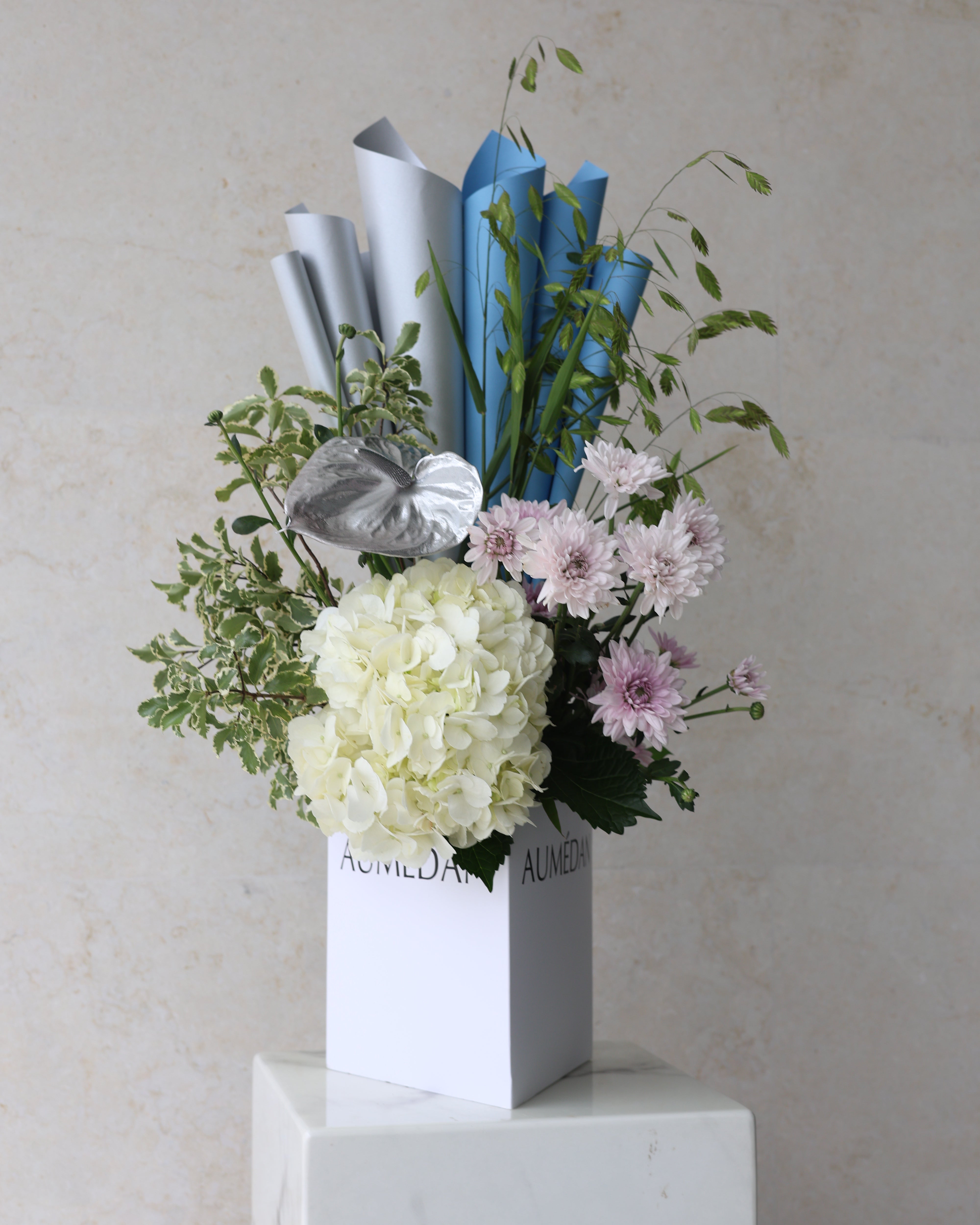CLESTIAL GLOW - TRITOTE BAG ARRANGEMENT
